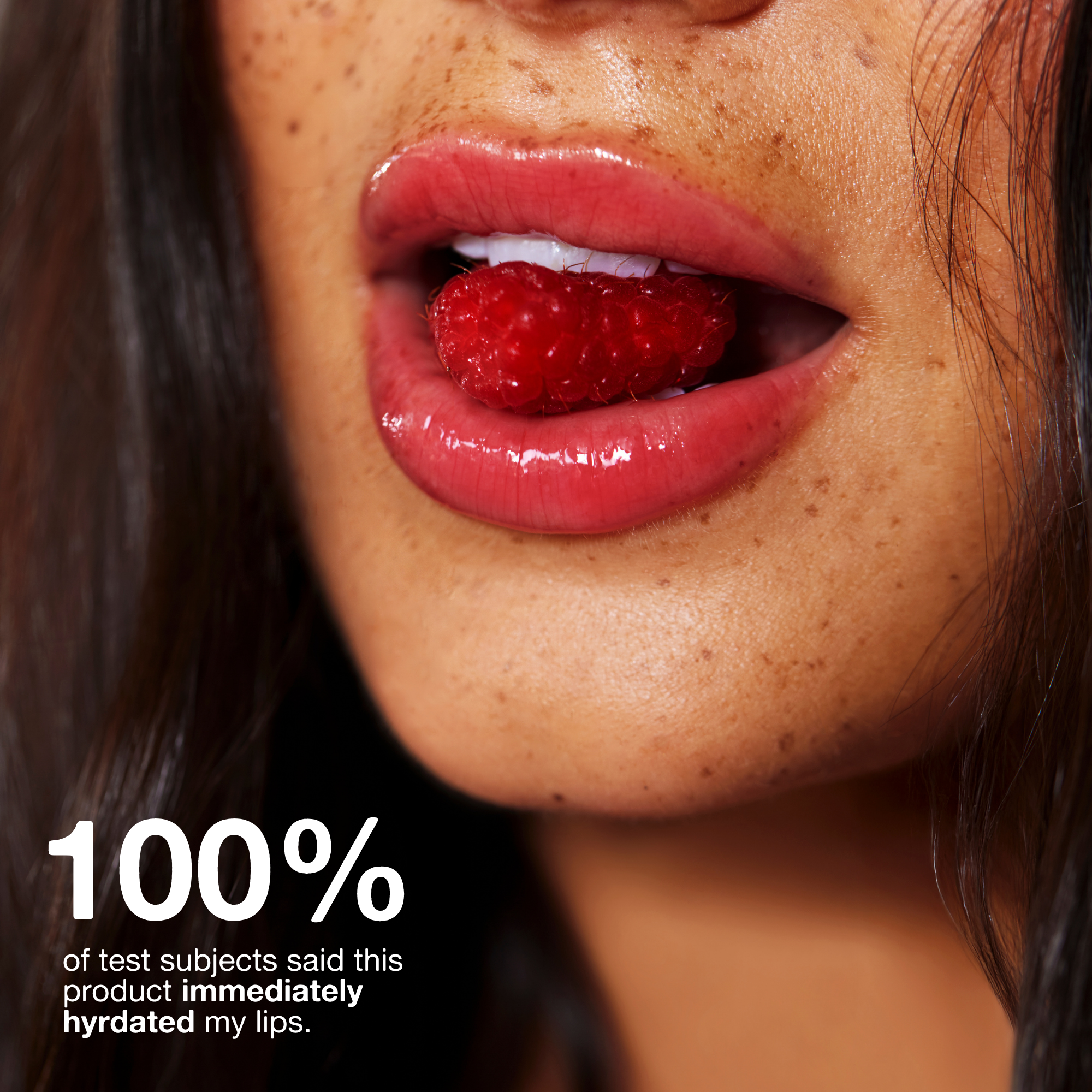 Close-up of a person's lips with a raspberry, with text about lip product hydration.